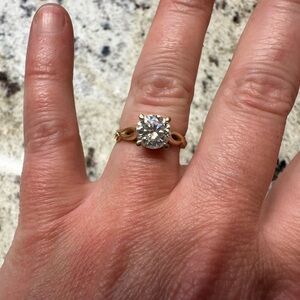 A 1.5 carat Mossanite ring set in 14 carat yellow gold-size 5 3/4